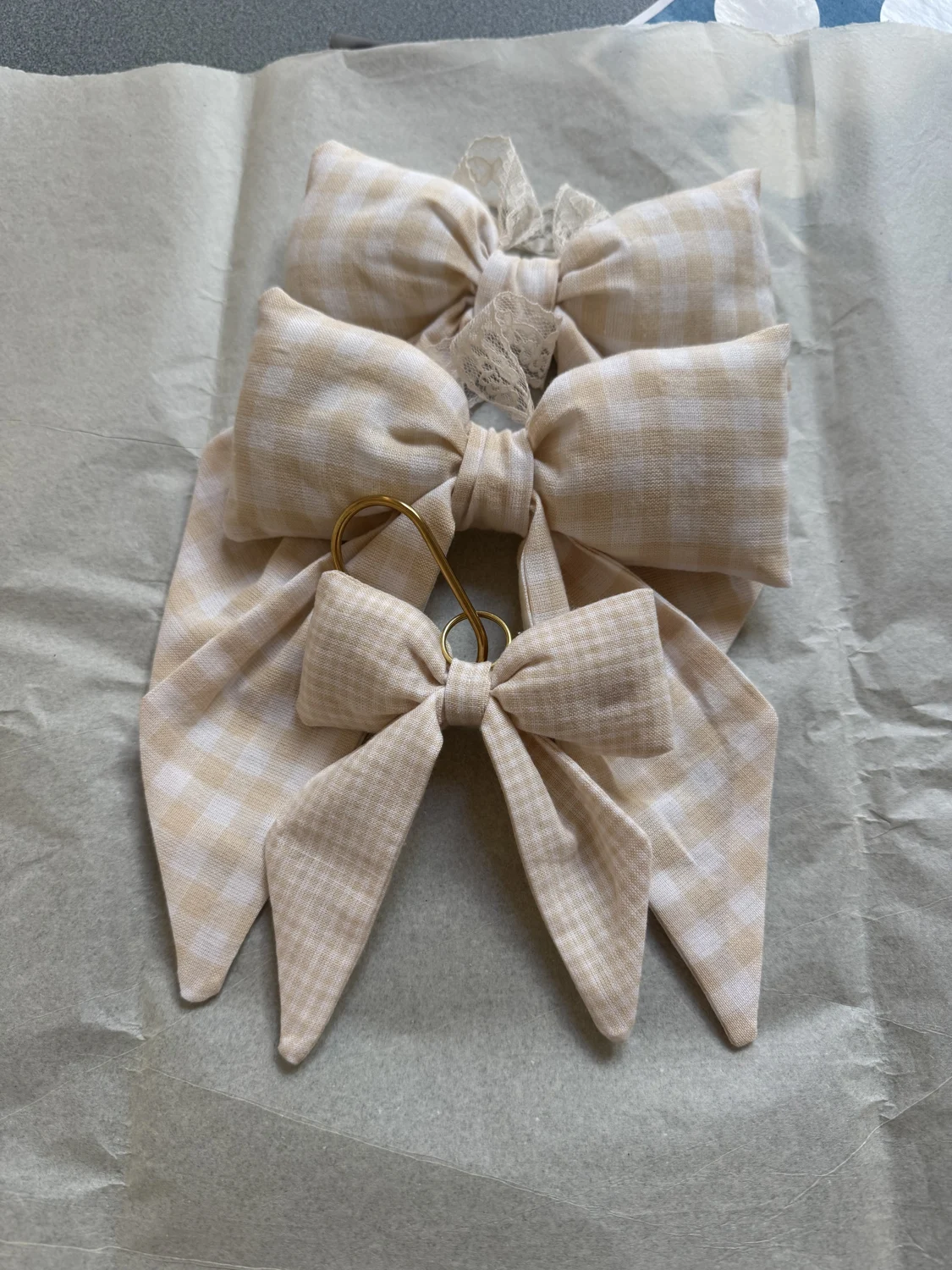 Neutral gingham fabric bows on tissue paper