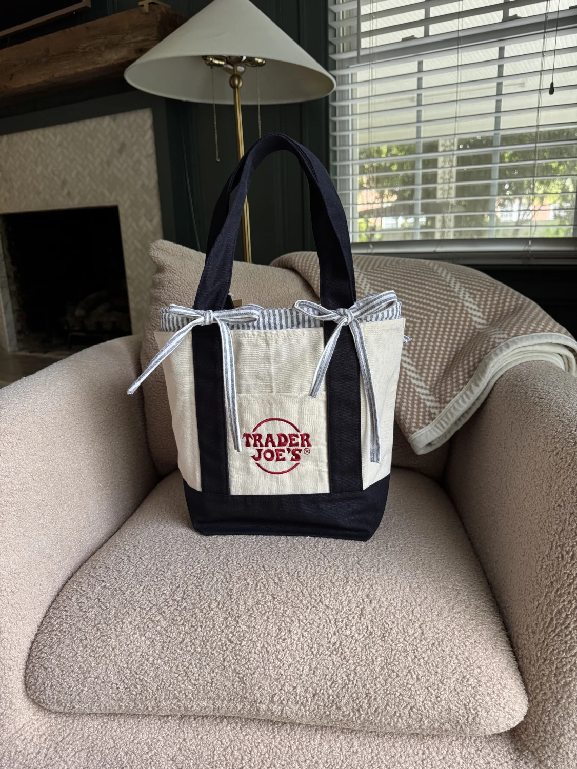 Cream and navy Trader Joe’s tote with a striped liner