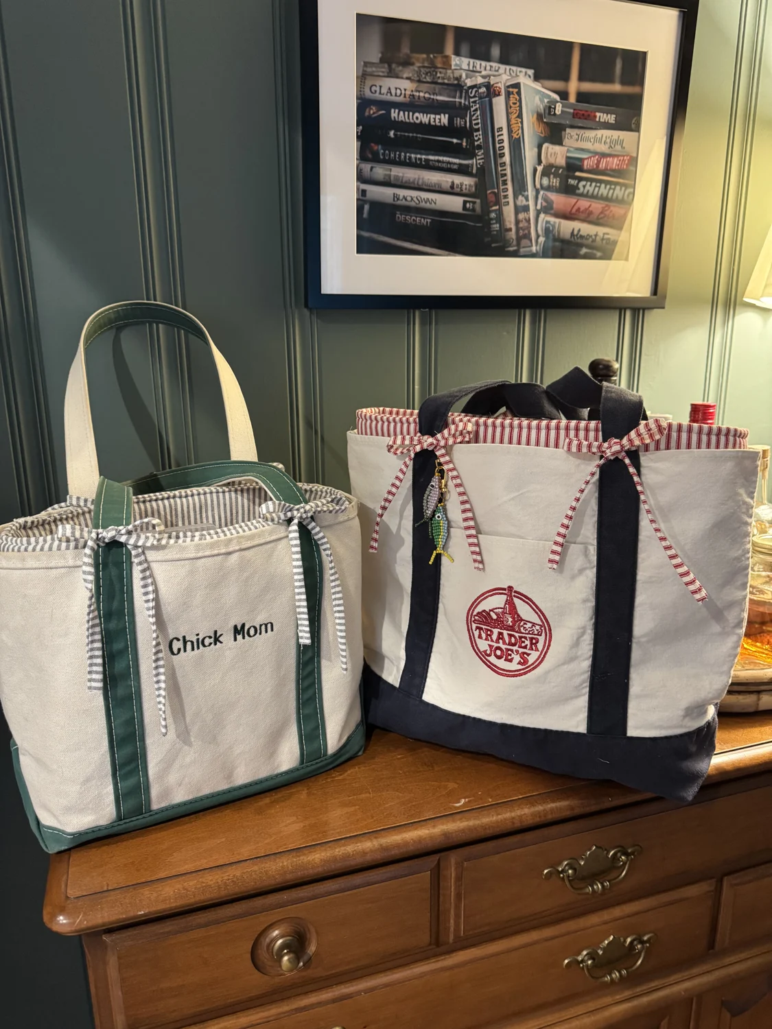 Three totes with patterned liners on a wooden cabinet