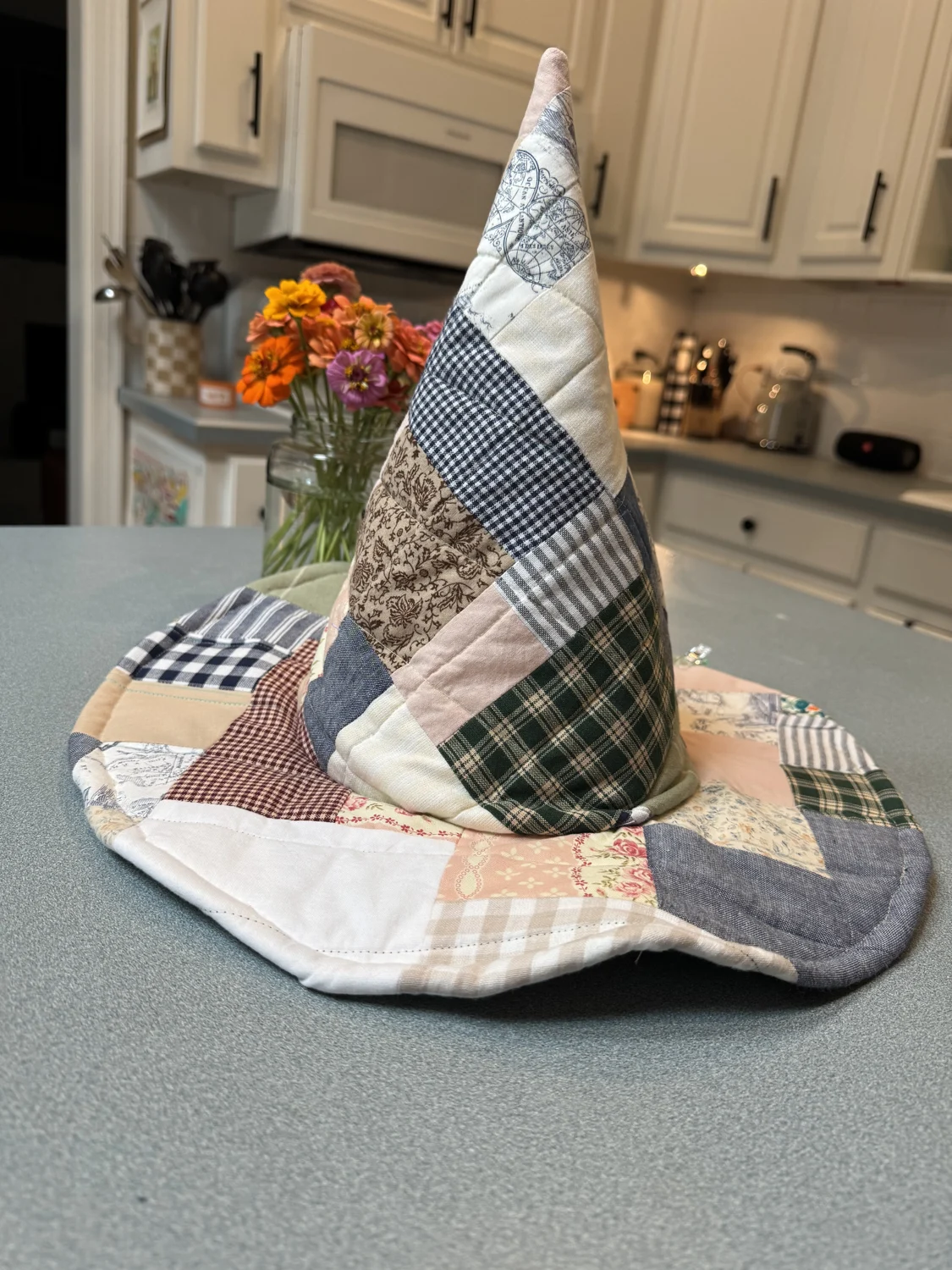 Patchwork fabric witch hat with a scalloped brim
